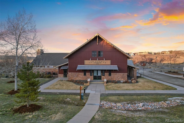 2320 Morningview Ln, Castle Rock, CO 80109 - view of front of house with stone siding and a chimney