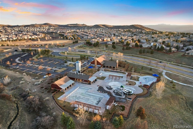 aerial view at dusk with a residential view and a mountain view