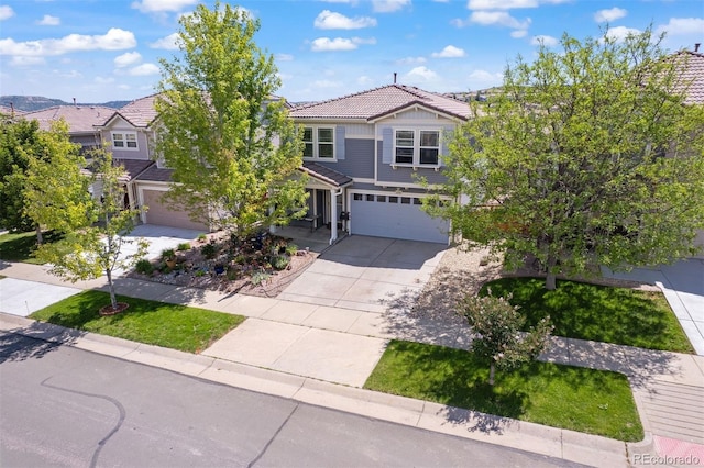 2320 Morningview Ln, Castle Rock, CO 80109 - view of front of property with an attached garage, driveway, and a tile roof