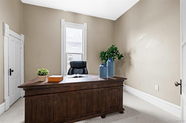 office featuring light colored carpet and baseboards