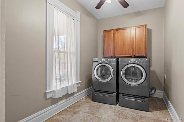laundry room with cabinet space, independent washer and dryer, a ceiling fan, and baseboards