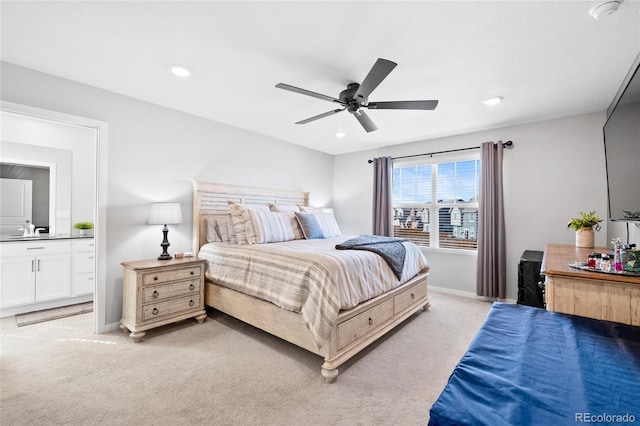 bedroom featuring recessed lighting, light colored carpet, and baseboards