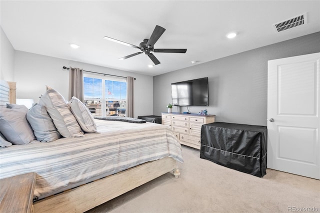 bedroom with ceiling fan, recessed lighting, visible vents, and light carpet