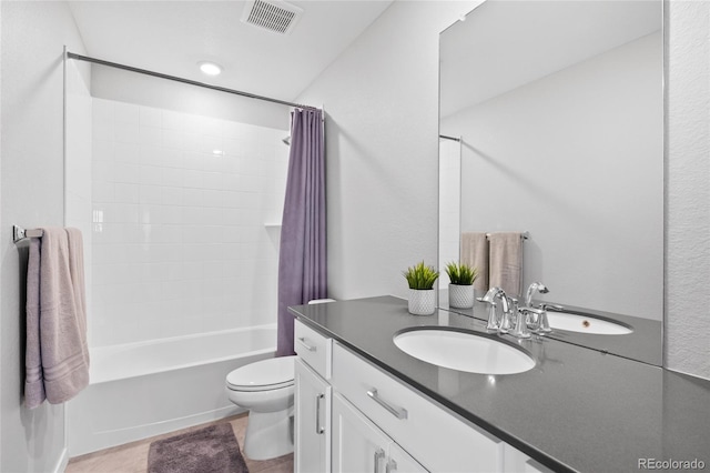 full bath with visible vents, toilet, shower / bath combo, and vanity