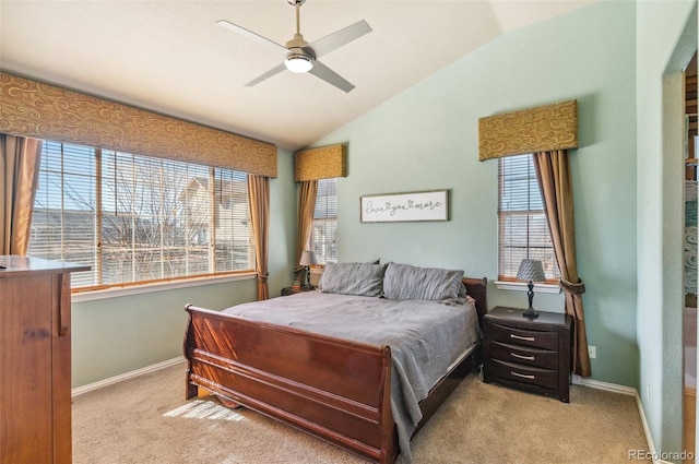 carpeted bedroom featuring multiple windows, vaulted ceiling, and baseboards