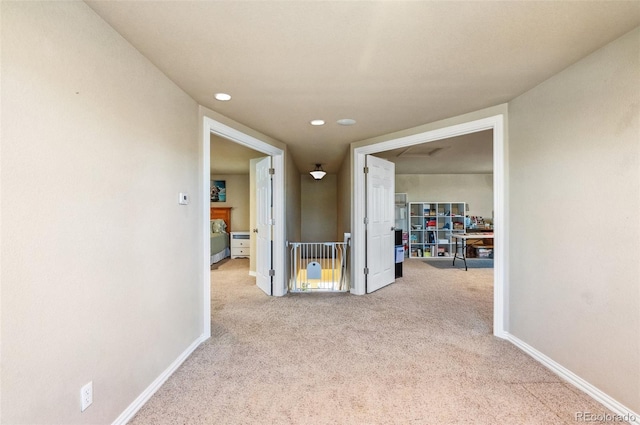 corridor with recessed lighting, carpet, and baseboards