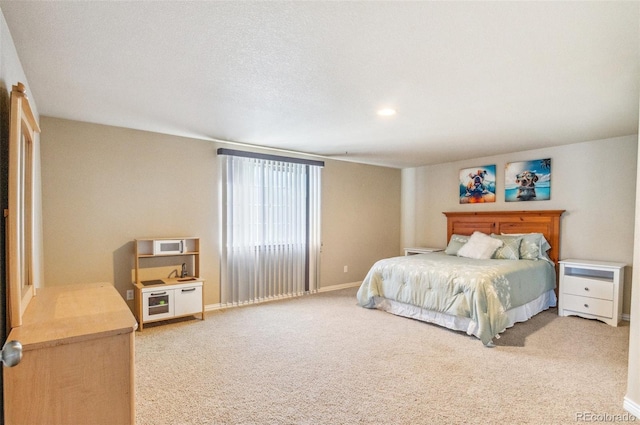 bedroom with baseboards, recessed lighting, and light colored carpet