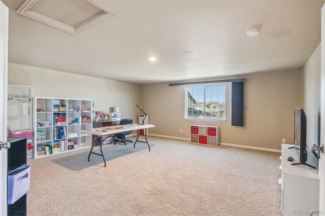 carpeted home office with attic access and baseboards