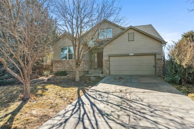 view of front of property with a garage, stone siding, concrete driveway, and roof with shingles