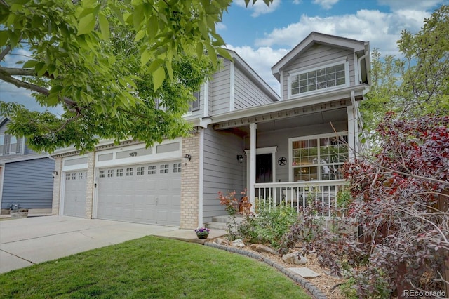 9079 Garnet St, Highlands Ranch, CO 80126 - view of front of home featuring covered porch, brick siding, driveway, and a garage