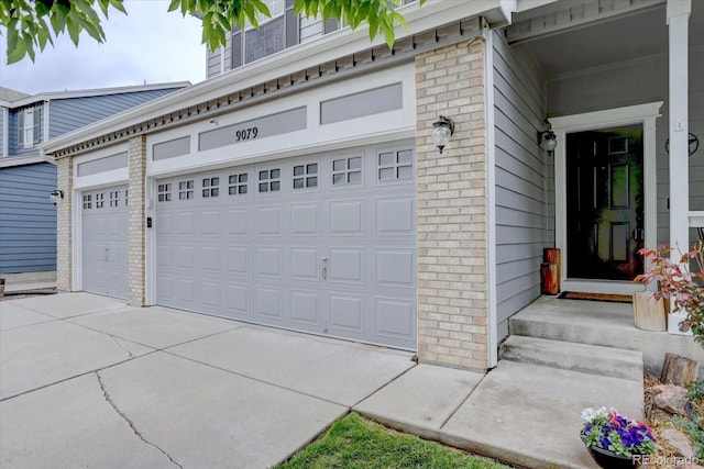 9079 Garnet St, Highlands Ranch, CO 80126 - garage featuring concrete driveway
