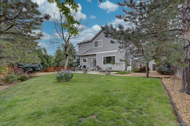 9079 Garnet St, Highlands Ranch, CO 80126 - back of property with a patio area