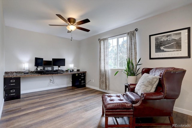 9079 Garnet St, Highlands Ranch, CO 80126 - office featuring a ceiling fan, wood finished floors, baseboards, and built in desk