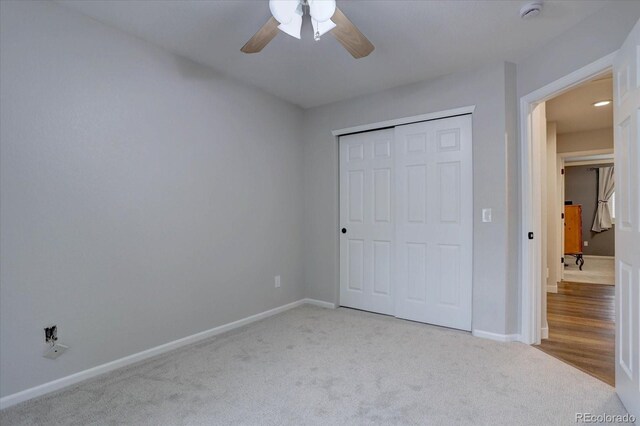 9079 Garnet St, Highlands Ranch, CO 80126 - unfurnished bedroom with carpet flooring, baseboards, a closet, and a ceiling fan