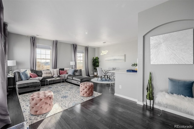 living room featuring dark wood-type flooring