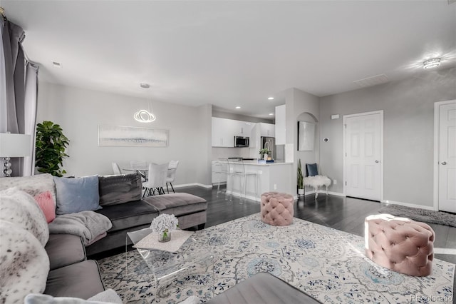 living room featuring dark hardwood / wood-style flooring