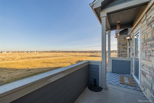 balcony featuring a rural view