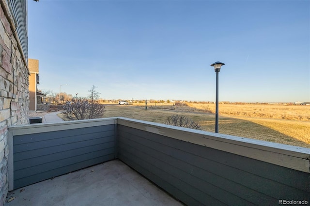 balcony featuring a rural view