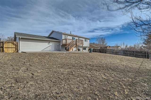 rear view of house with a yard