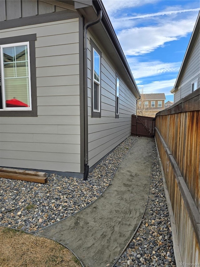 view of property exterior with fence