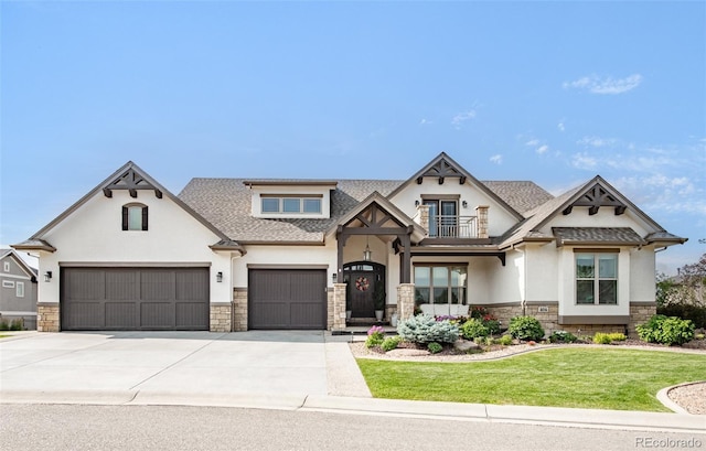 view of front of home featuring a garage and a front yard