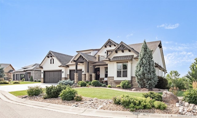 view of front of house with a front lawn and a garage