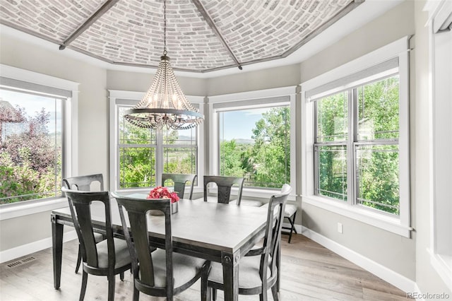 dining room featuring a chandelier and light wood-type flooring