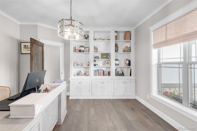 home office featuring light hardwood / wood-style floors, an inviting chandelier, and ornamental molding