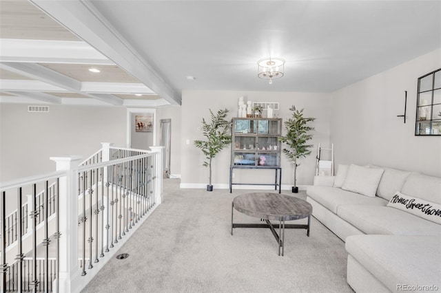 living room with carpet floors and beam ceiling