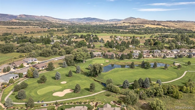 drone / aerial view with a water and mountain view