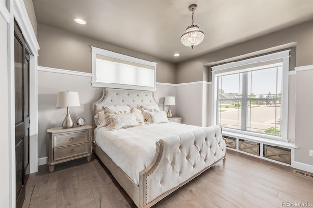 bedroom featuring wood-type flooring