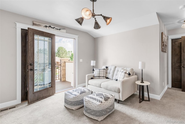 living room featuring vaulted ceiling and carpet flooring