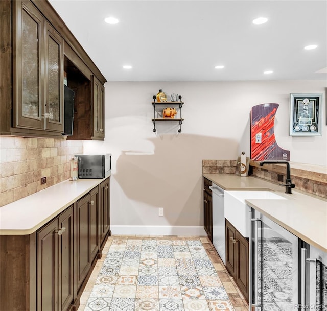 interior space featuring tasteful backsplash, dark brown cabinetry, and light tile patterned flooring