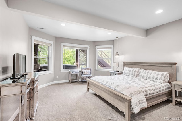 carpeted bedroom featuring beamed ceiling