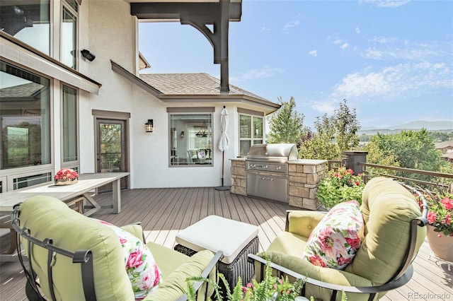 balcony featuring an outdoor kitchen, area for grilling, and an outdoor hangout area