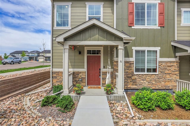 16818 E 119th Ave Unit A, Commerce City, CO 80022 - property entrance featuring stone siding and board and batten siding
