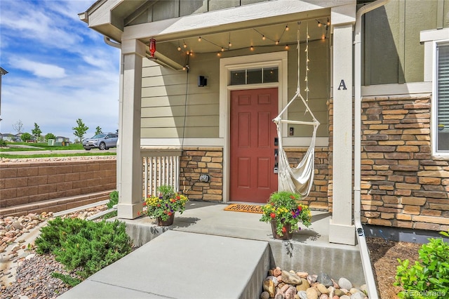 16818 E 119th Ave Unit A, Commerce City, CO 80022 - entrance to property featuring a porch and stone siding