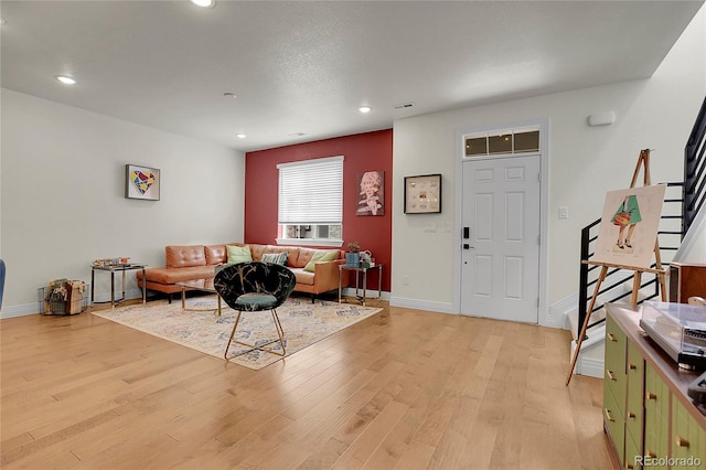 16818 E 119th Ave Unit A, Commerce City, CO 80022 - living area featuring light wood-style floors, recessed lighting, baseboards, and stairs