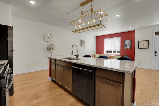 16818 E 119th Ave Unit A, Commerce City, CO 80022 - kitchen with a sink, dishwasher, light wood finished floors, gas stove, and recessed lighting