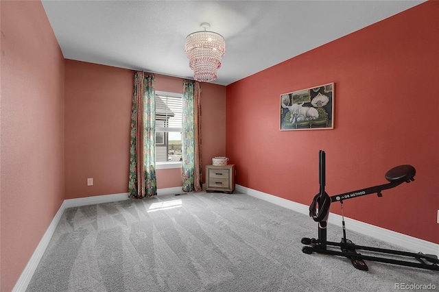 16818 E 119th Ave Unit A, Commerce City, CO 80022 - workout area with a chandelier, carpet floors, and baseboards