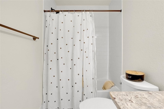 16818 E 119th Ave Unit A, Commerce City, CO 80022 - bathroom with toilet and shower / bath combo with shower curtain