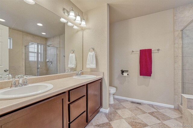 7963 Bonfire Trl, Fountain, CO 80817 - full bath featuring a shower stall, toilet, and double vanity