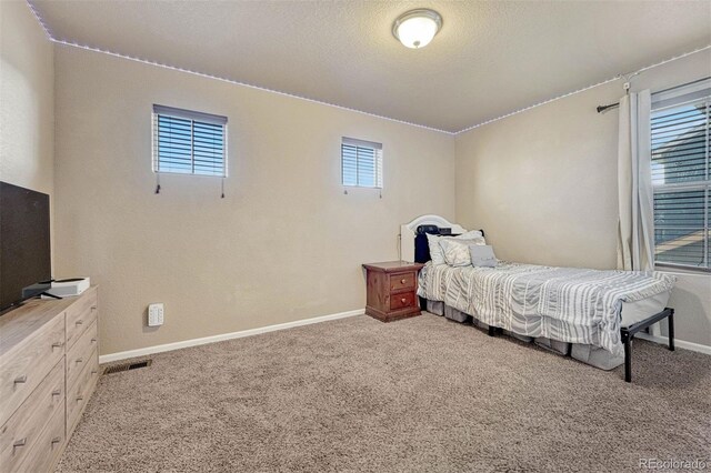 7963 Bonfire Trl, Fountain, CO 80817 - bedroom featuring carpet flooring and baseboards