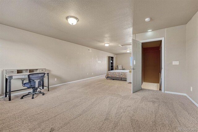 7963 Bonfire Trl, Fountain, CO 80817 - carpeted bedroom with a textured ceiling and baseboards