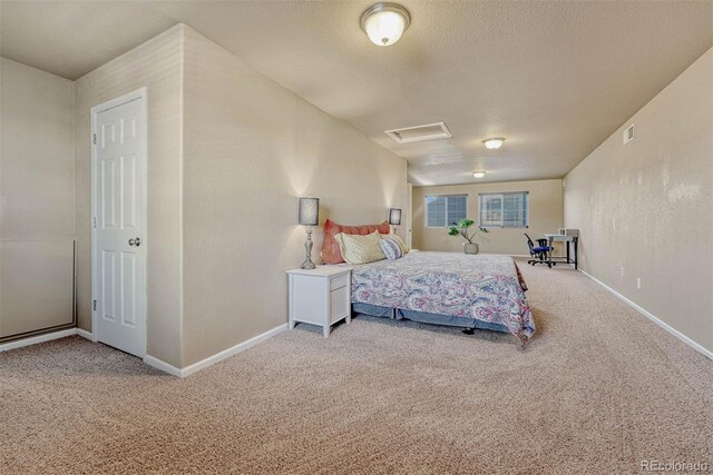7963 Bonfire Trl, Fountain, CO 80817 - bedroom featuring carpet floors, baseboards, and a textured ceiling