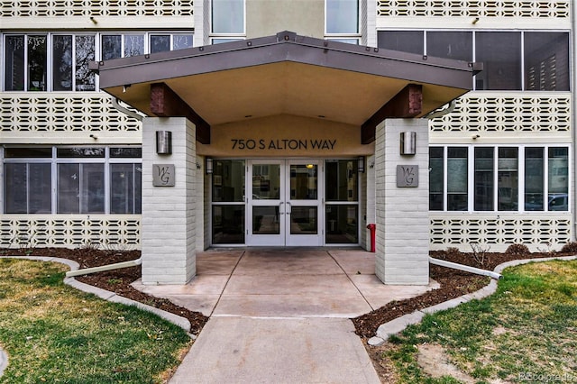 view of exterior entry featuring french doors