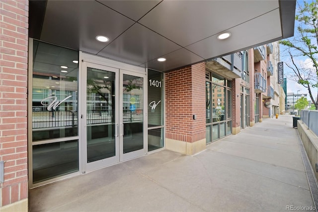 property entrance with brick siding