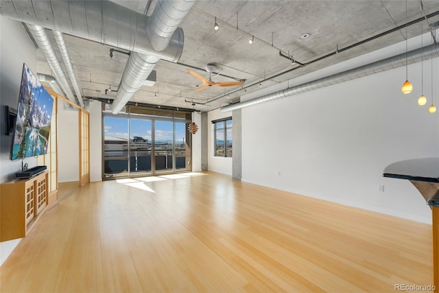 unfurnished living room featuring wood finished floors