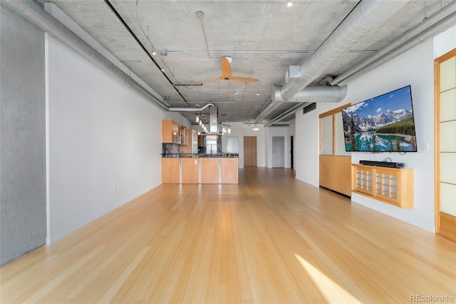 unfurnished living room featuring wood finished floors