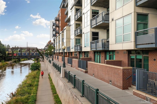 view of building exterior with a water view